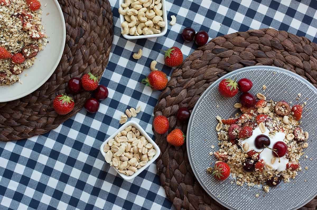 Yogurt granola bowls with strawberries and cherries